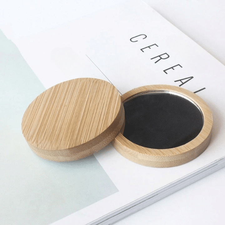 Stack of round wooden pocket mirrors