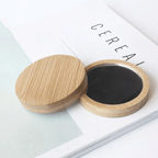 Stack of round wooden pocket mirrors