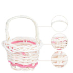 Tiny handwoven basket with handle held between fingers