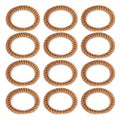 Set of twelve hand woven rattan napkin rings in a warm honey tone