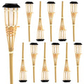 Set of twelve woven rattan solar garden lights on stakes