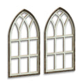 Two arched cathedral style window frames in distressed wood