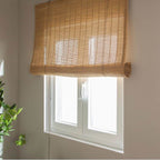 Two matching brown bamboo roll up blinds with cords and top brackets