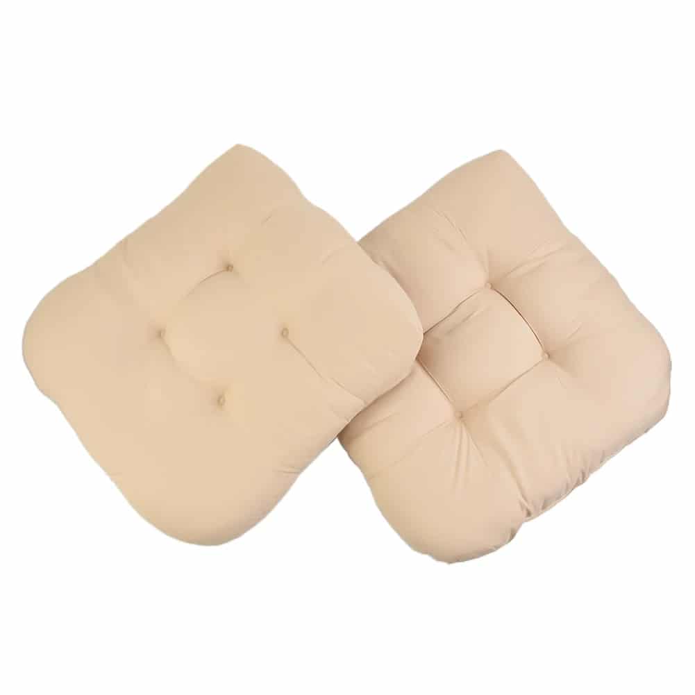 Two thick beige polyester seat cushions with ties for rattan chairs