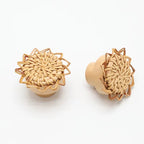 Two small flower shaped hand woven rattan furniture knobs