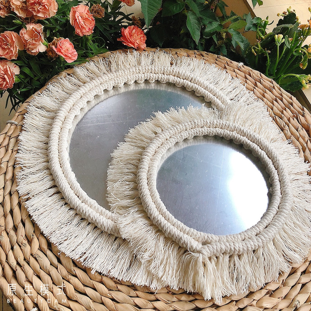 Two round mirrors with white macrame fringe frames
