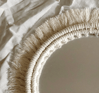 Two round mirrors with white macrame fringe frames