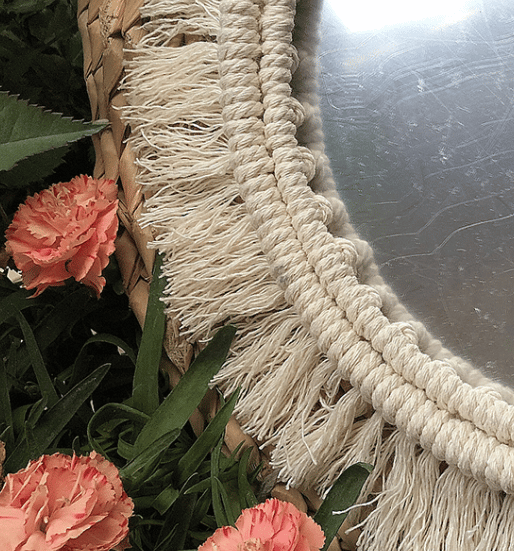 Two round mirrors with white macrame fringe frames