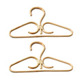 Two hand woven rattan clothes hangers with gold metal hooks and inner hooks