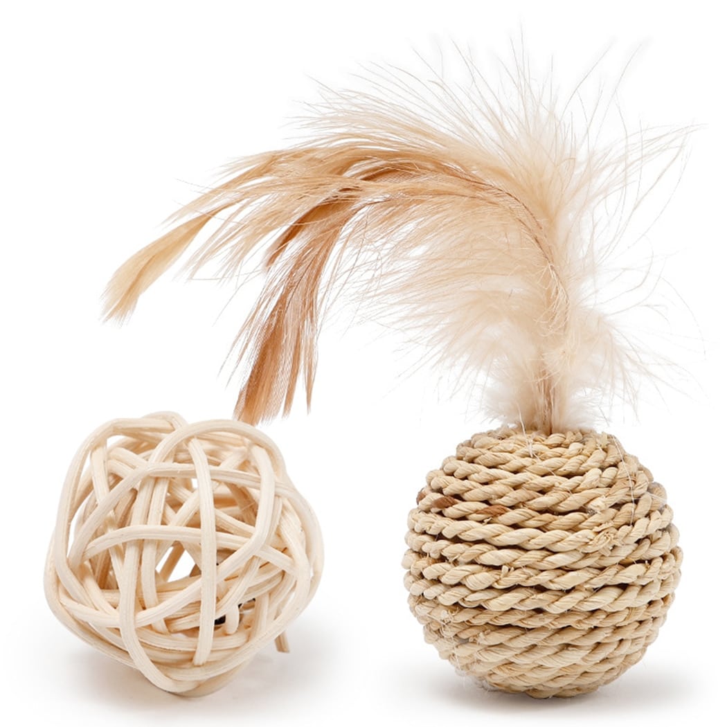 Open weave rattan cat ball next to a wrapped ball with a feather tuft