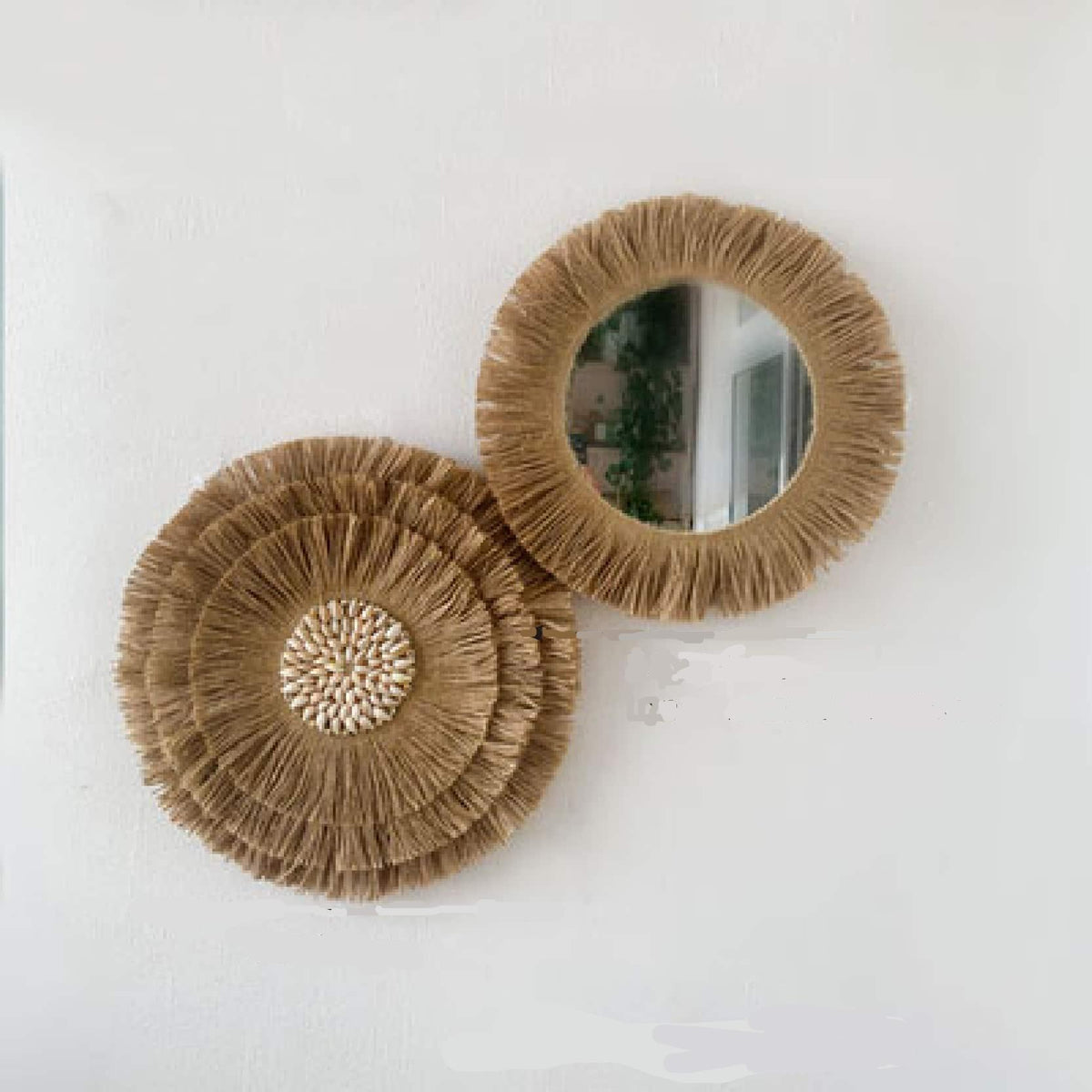 Two round mirrors framed by natural woven fringe