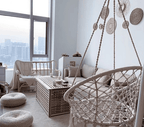 Two round mirrors framed by natural woven fringe
