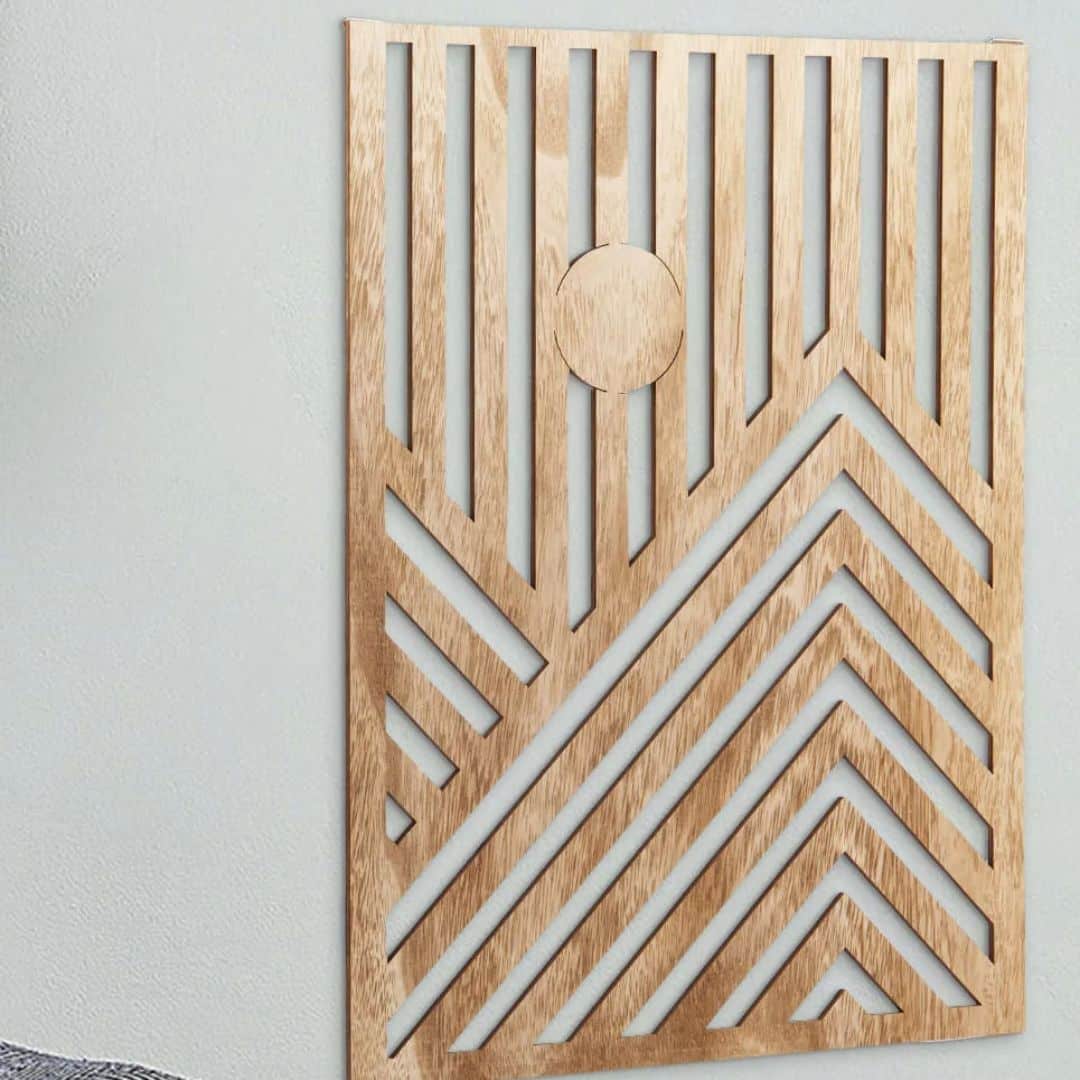 Three overlapping geometric cut out wood wall panels