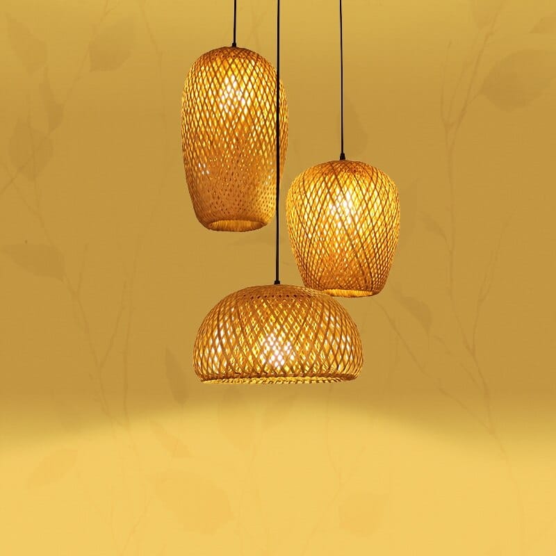 Three woven rattan pendants of different shapes hung as a cluster