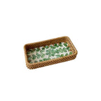 Set of three handwoven rattan trays with woven leaf pattern