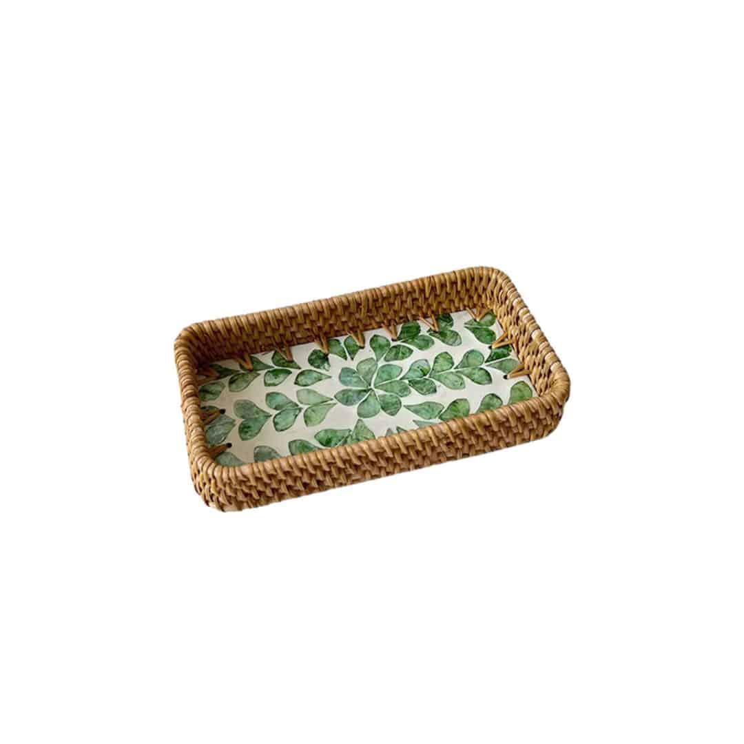 Set of three handwoven rattan trays with woven leaf pattern