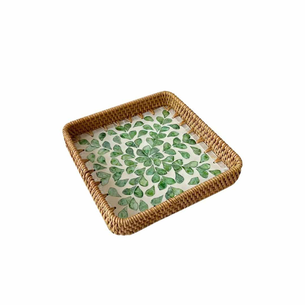 Set of three handwoven rattan trays with woven leaf pattern