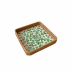 Set of three handwoven rattan trays with woven leaf pattern