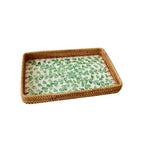 Set of three handwoven rattan trays with woven leaf pattern