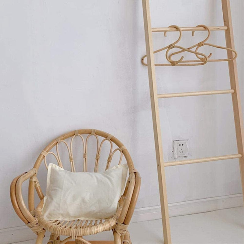 Kids' clothes hanger hand woven in natural rattan in a simple shape