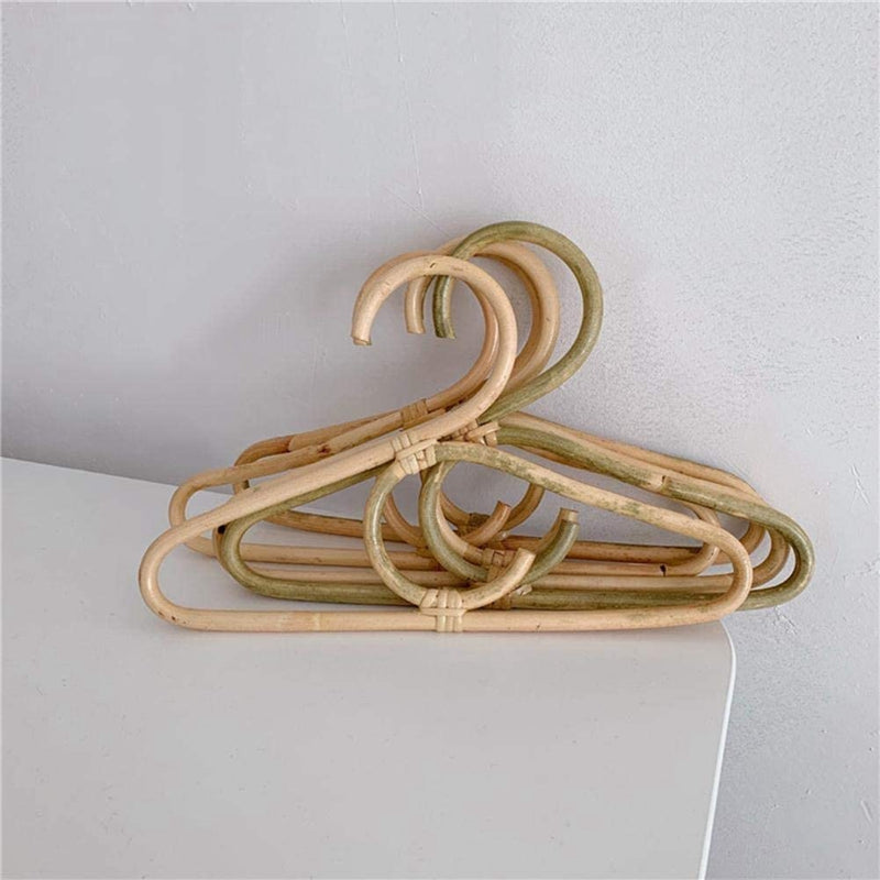 Kids' clothes hanger hand woven in natural rattan in a simple shape
