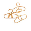 Kids' clothes hanger hand woven in natural rattan in a fancy shape