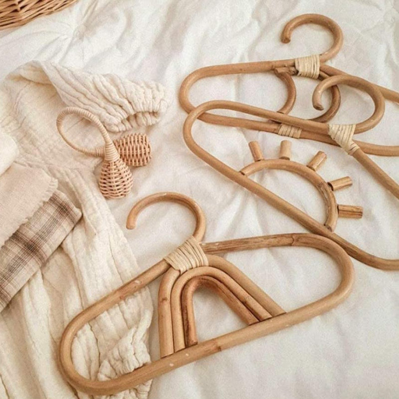 Kids' clothes hanger hand woven in natural rattan in a fancy shape