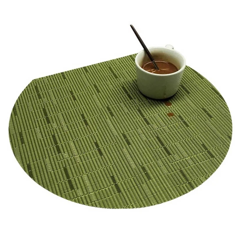 Four semi round green woven bamboo placemats