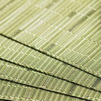 Four semi round green woven bamboo placemats