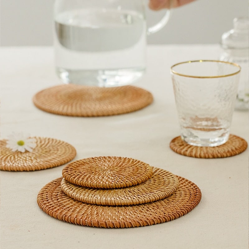 Set of four round hand woven natural rattan coasters