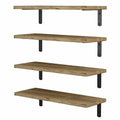 Set of four light wood floating shelves arranged on a wall