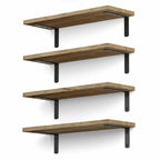Set of four light wood floating shelves arranged on a wall