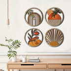 Four round layered wood wall art pieces with boho sun and leaf designs