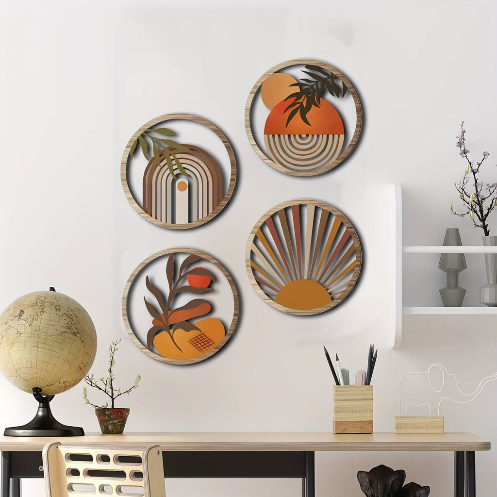 Four round layered wood wall art pieces with boho sun and leaf designs