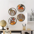 Four round layered wood wall art pieces with boho sun and leaf designs