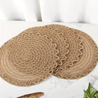 Four round woven linen placemats with a wavy edge in warm brown