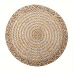 Four round woven linen placemats with a wavy edge in warm brown