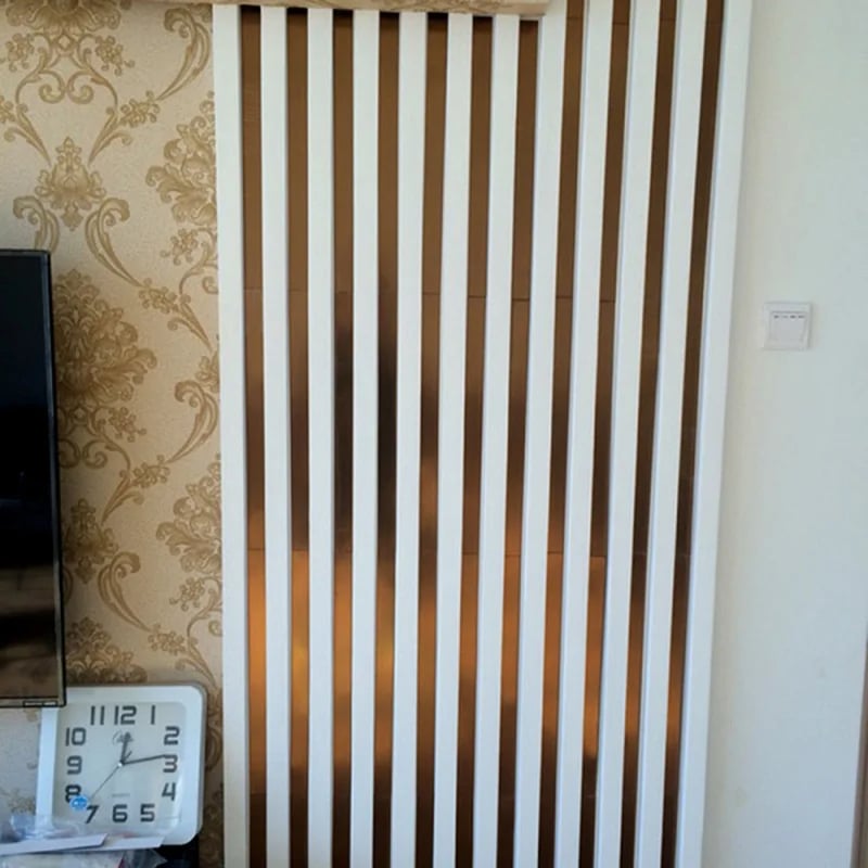 Five vertical acrylic mirror strips on a wall