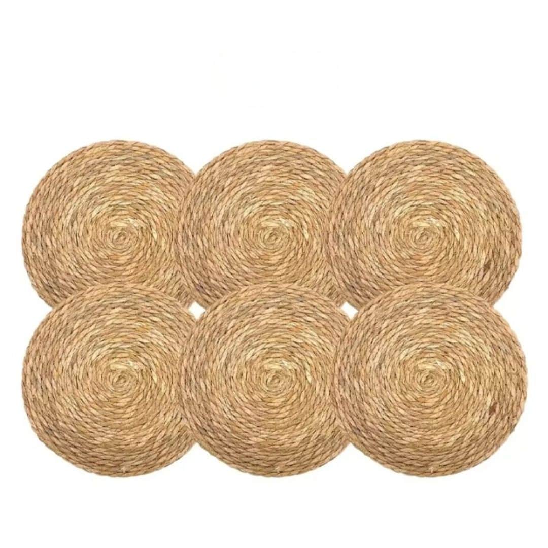 Six round hand braided beige straw placemats