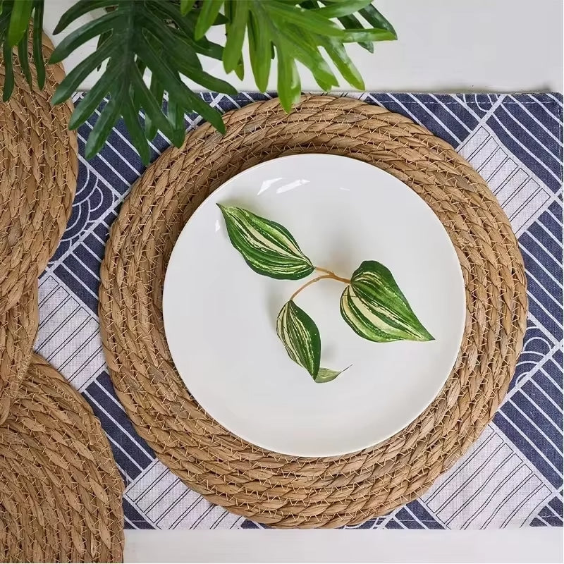 Six round hand braided beige straw placemats
