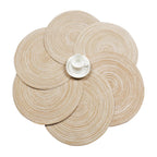 Six round beige coasters with a woven rattan look