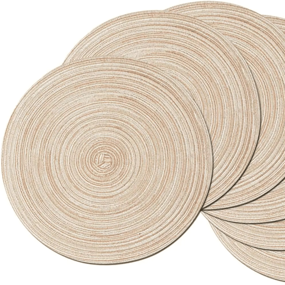 Six round beige coasters with a woven rattan look