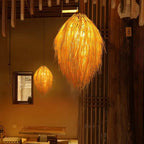 Tall shaggy natural fringe rattan chandelier