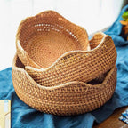 Shallow round honey rattan baskets with wavy rims