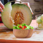 Small round acacia wood bowl with a visible natural grain