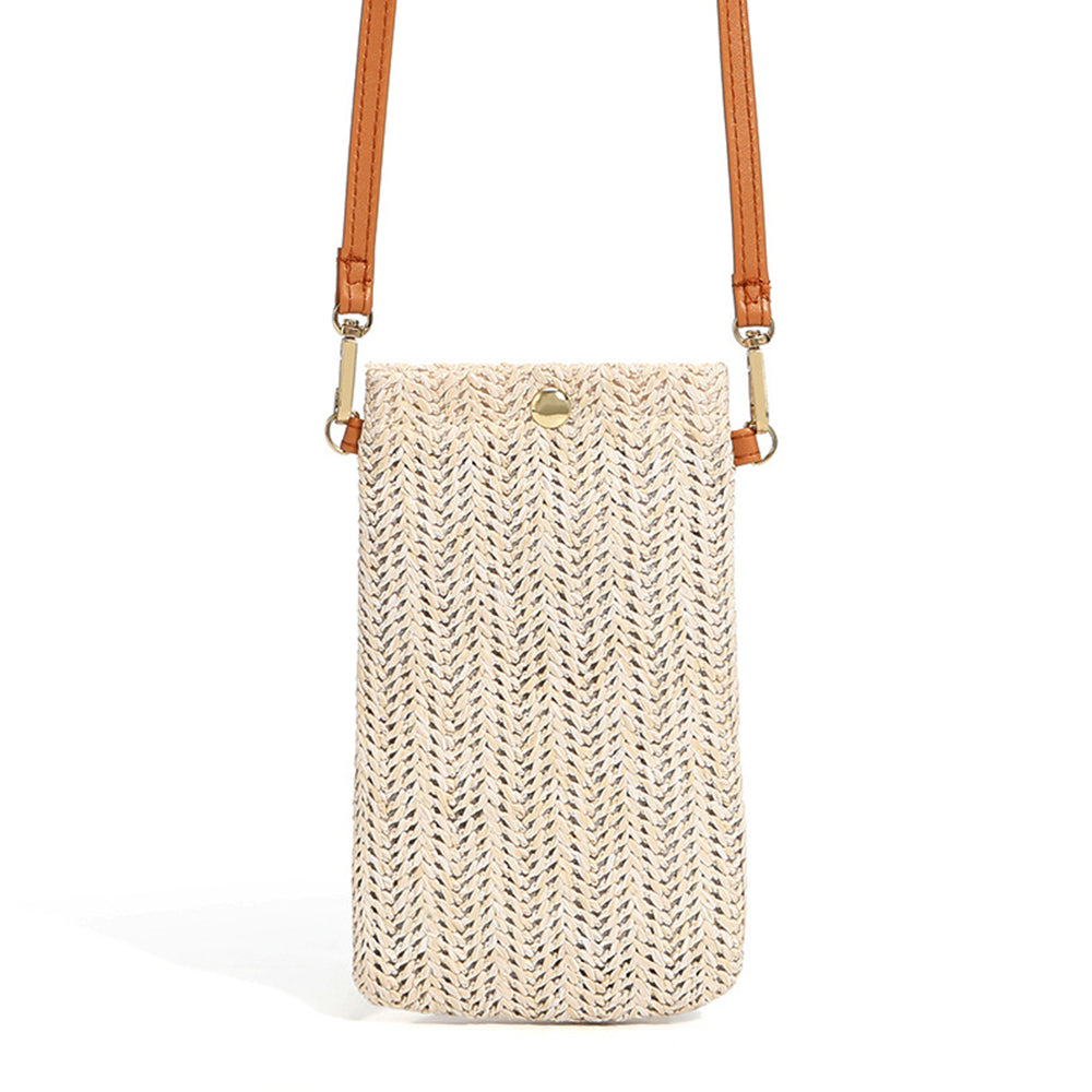 Small rounded beige hand woven rattan crossbody bag with a button closure