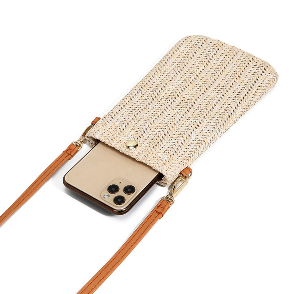 Small rounded beige hand woven rattan crossbody bag with a button closure