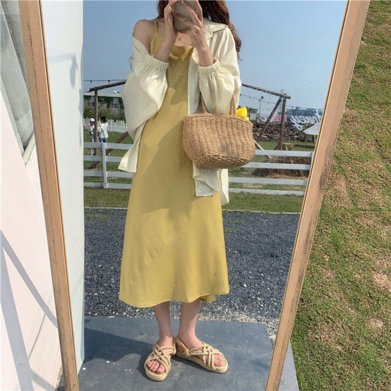 Small structured hand woven rattan handbag with warm natural highlights