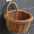 Small wicker basket hanging on a wall by its handle