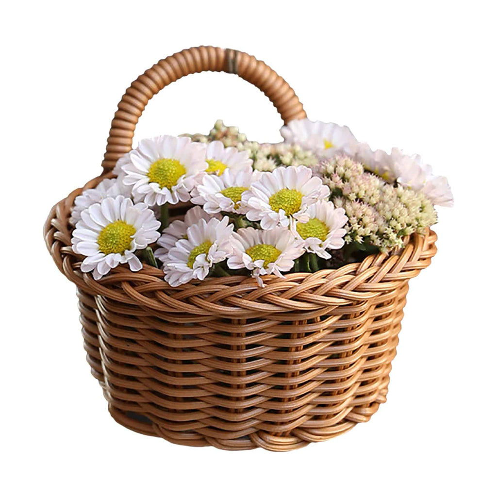Small wicker basket hanging on a wall by its handle